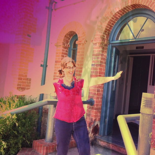 tangerine Meg on the steps of the old Goolwa Police Station; rosy filter on the photo