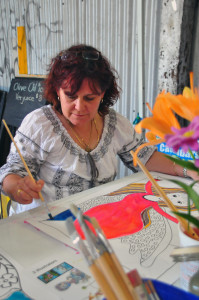 Priscilla and her artwork in progress