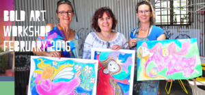 three bold art workshop students display their colourful beautiful creations