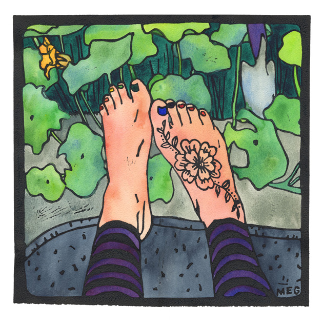 Legs in leggings with pale bare henna-ed feet, on a blanket beside a nasturtium garden