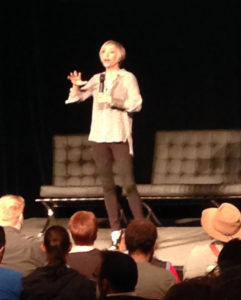 Nana Visitor, Star Trek DS9 actress, on stage at Oz Comic-Con in 2014. A few audience heads are visible in the foreground