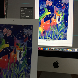 an art calendar page featuring a rainbow cat painting, and the matching cat art picture on a computer screen