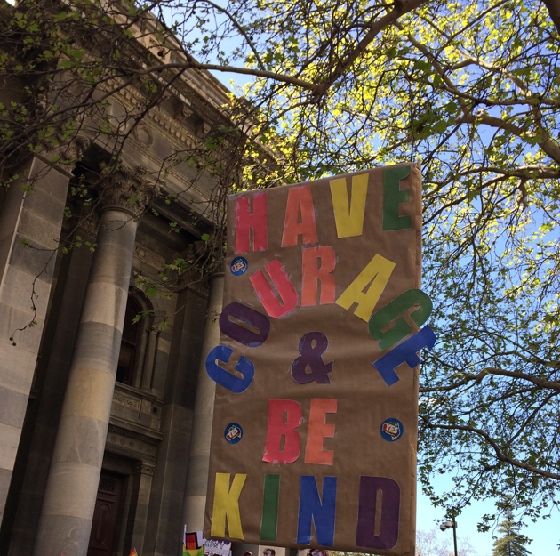 sign outside Parliament House: "Have Courage and Be Kind"