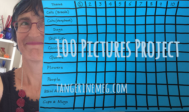 Tangerine Meg's face at left, looking towards a grid drawn on blue paper, a chart to track the progress of her 2018 100 Pictures Project