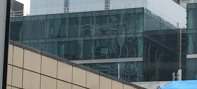 section of a city scape showing a rippled reflection